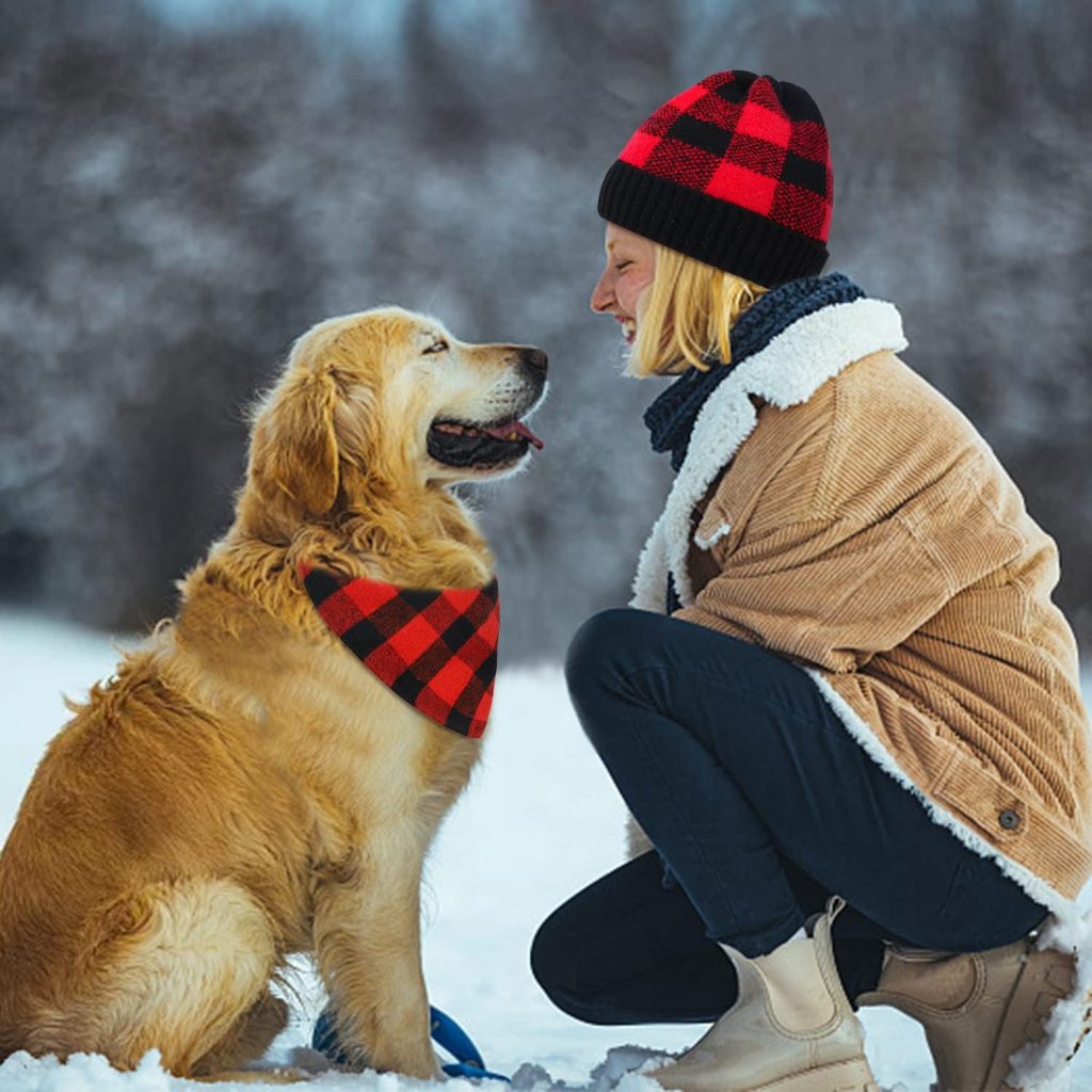 dog and woman wearing matching bandana and hat