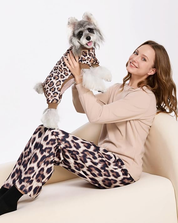 dog and owner wearing matching pajamas