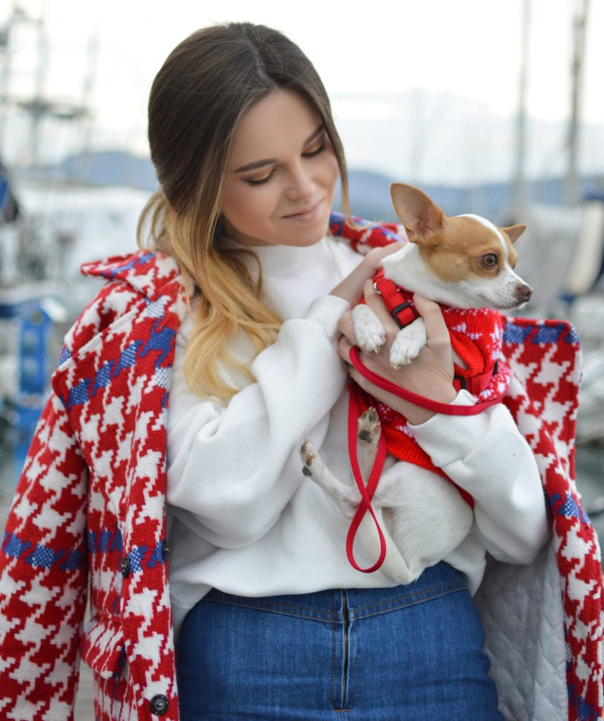 woman and dog matching red