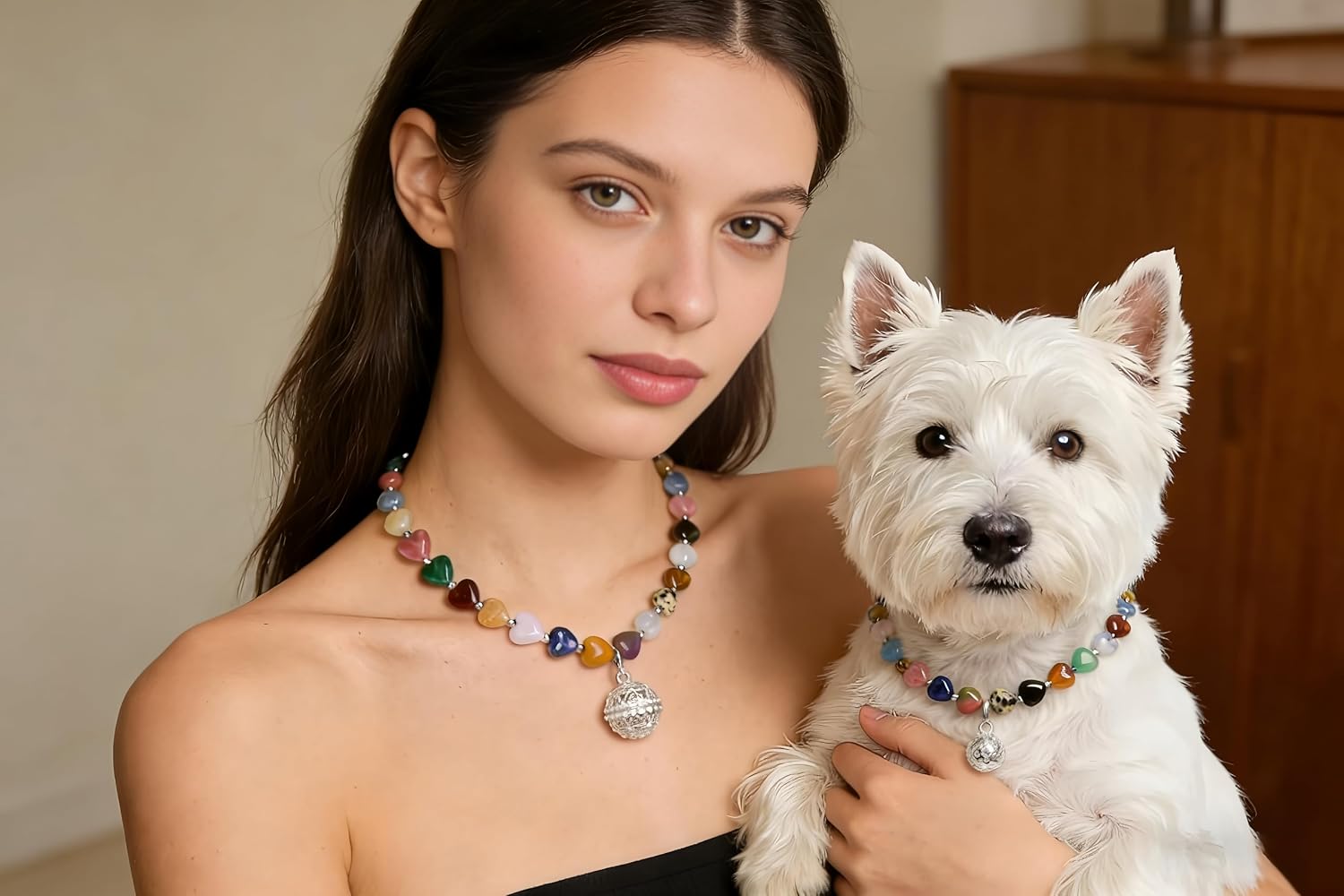 woman and dog wearing matching necklaces