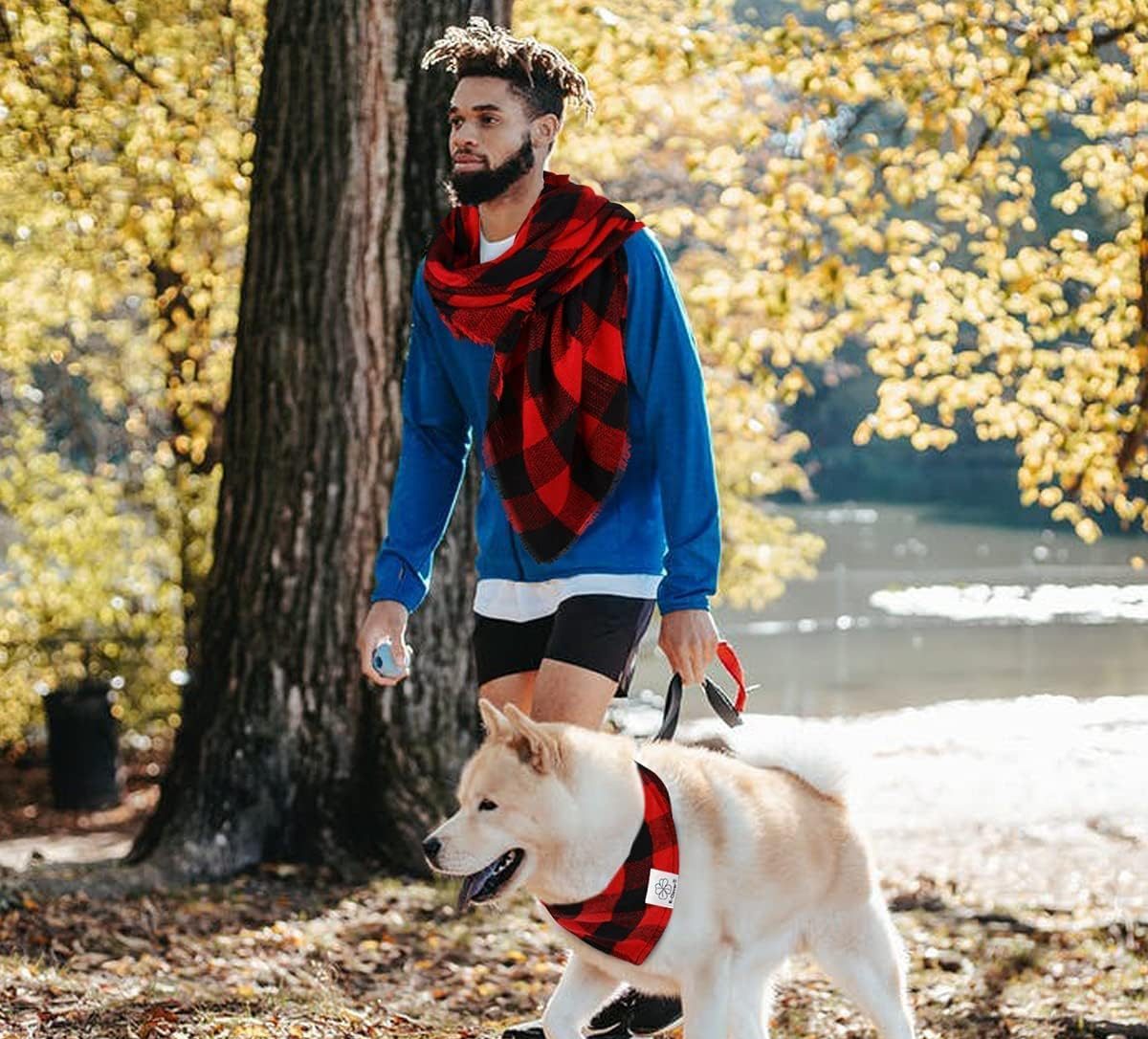 man and dog wearing matching scarves